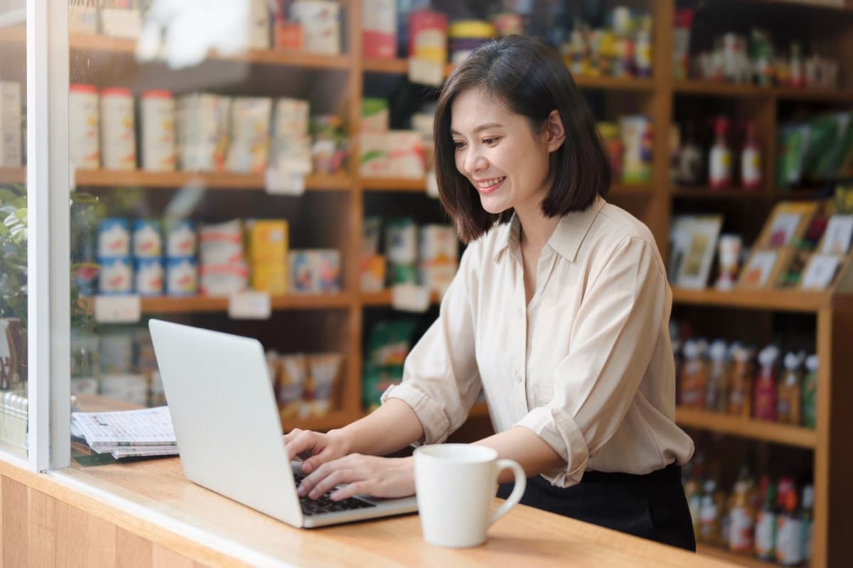 A shop owner exporting her product list at the counter